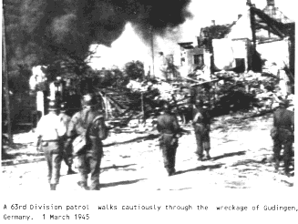 63rd Division Troops moving through Gudingen, Germany 1 Mar 45