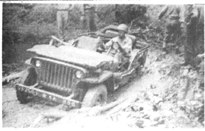 Bill Beckett, Hq 254th drives the obstacle course at CVD 1944
