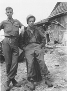 D/254th soldiers in front of German village quarters