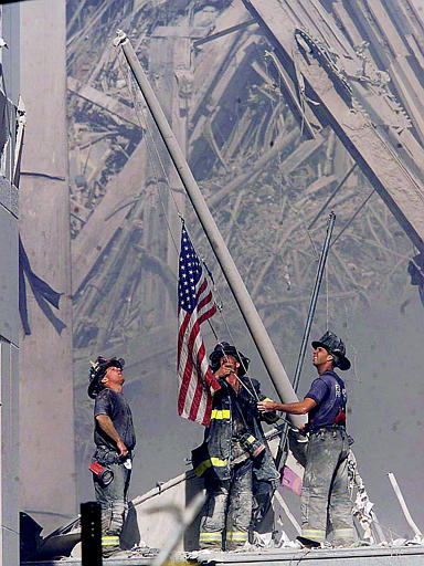 Firefighters raise American Flag