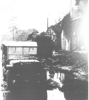 Jeep moves through Jebsheim after the Battle