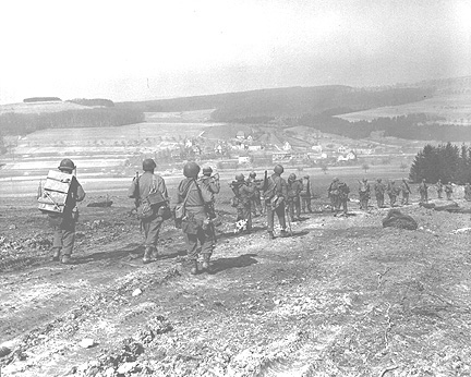 254th troops moving into Eschningen, Germany 15 Mar 45