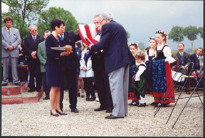 Angelo Christopher D/254th presents American Flag to Jebsheim Mayor 2000