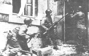 63rd Infantry Division soldiers look for snipers