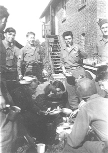 E/253d Infantry soldiers at chow. Germany 1945