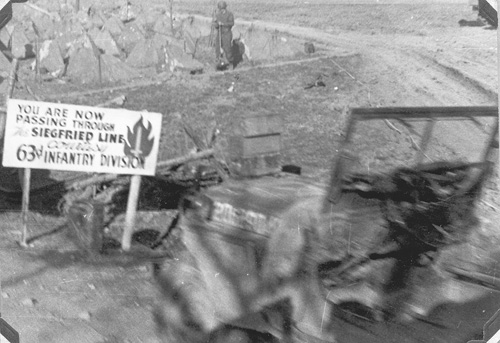 63d Inf Div sign leading through the Siegfried Line- 1945