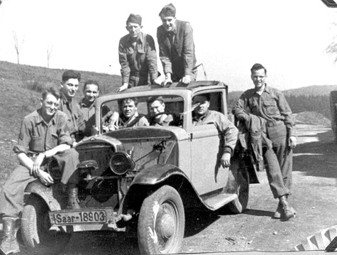 63d Band members in commandeered vehicle, Adelsheim, Ger 1945