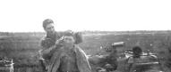 Lt Lookabaugh gets a haircut D/254th Inf