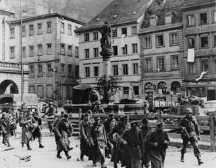 US Troops leading German POWs through Heidelberg, 1945